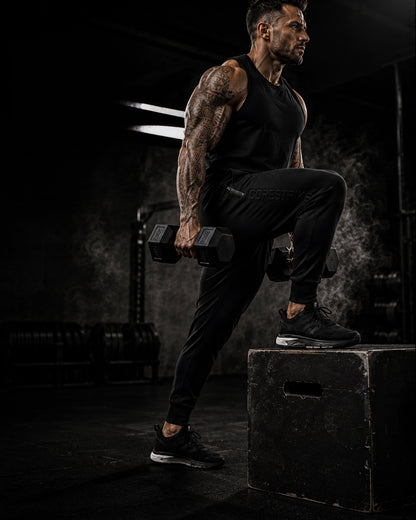 Man lifting weights on a dark background