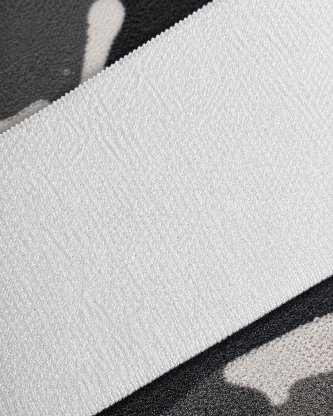 Close-up of a textured white surface with black borders