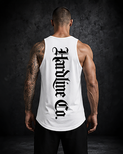 Person wearing a white tank top with black text  with Hardline Co. on the back against a dark background