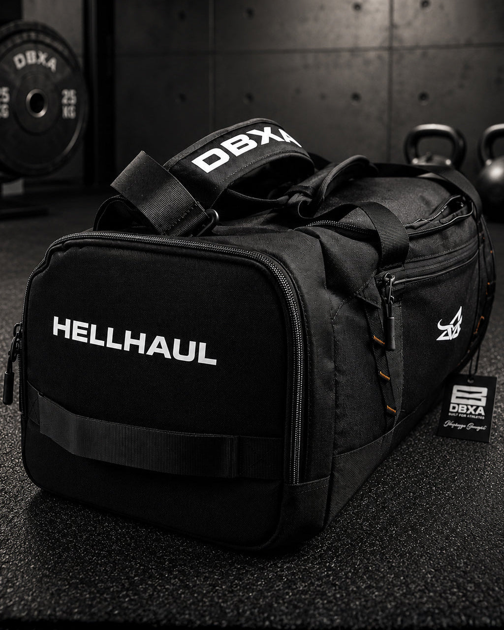 Black duffel bag with 'HELLHAUL' branding on a gym floor.