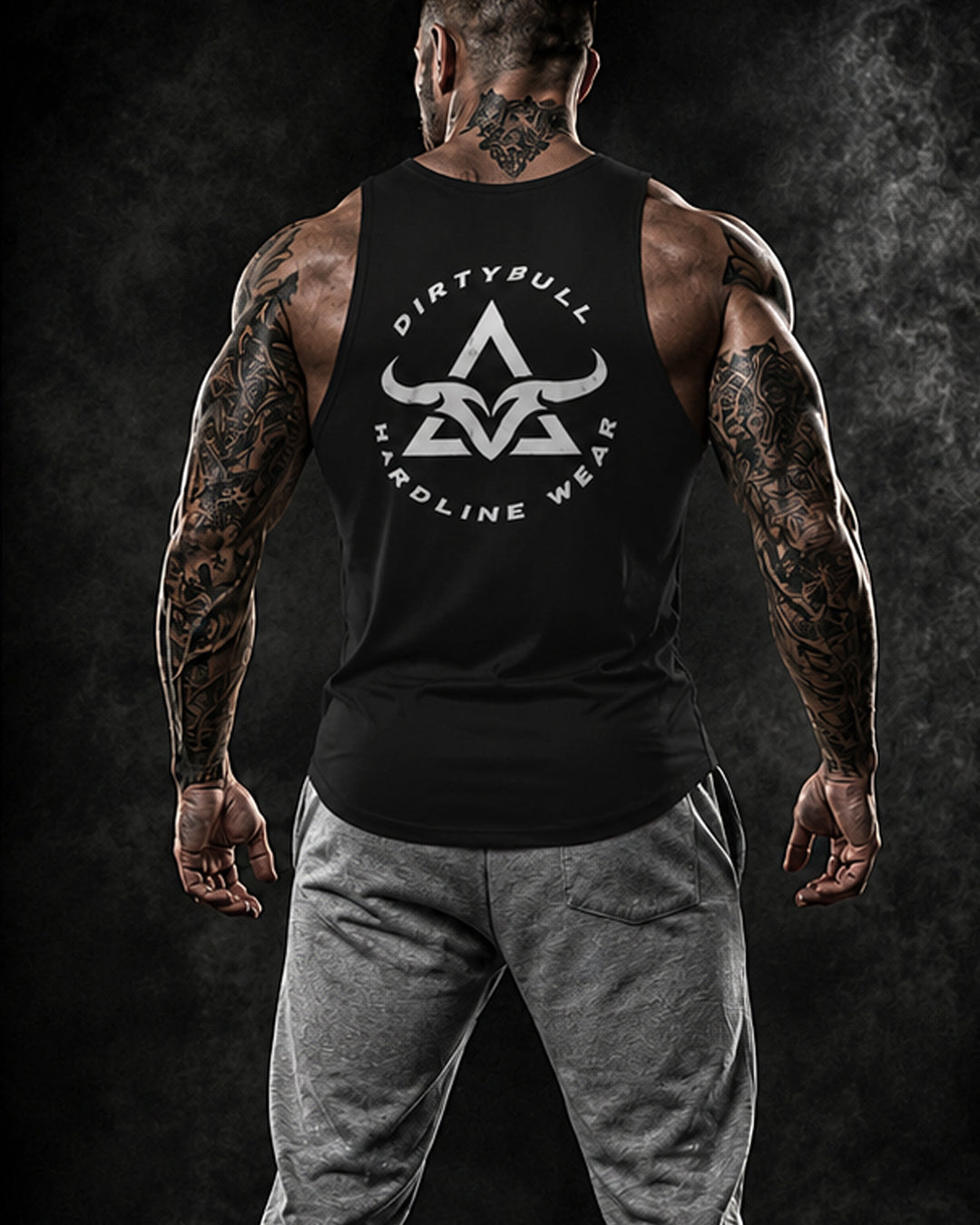 Man wearing a black tank top with &