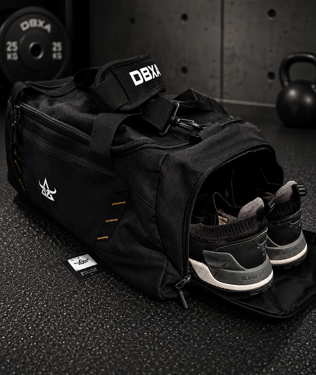 DBXA HellHaul bag with a pair of training shoes stored in the dedicated side compartment