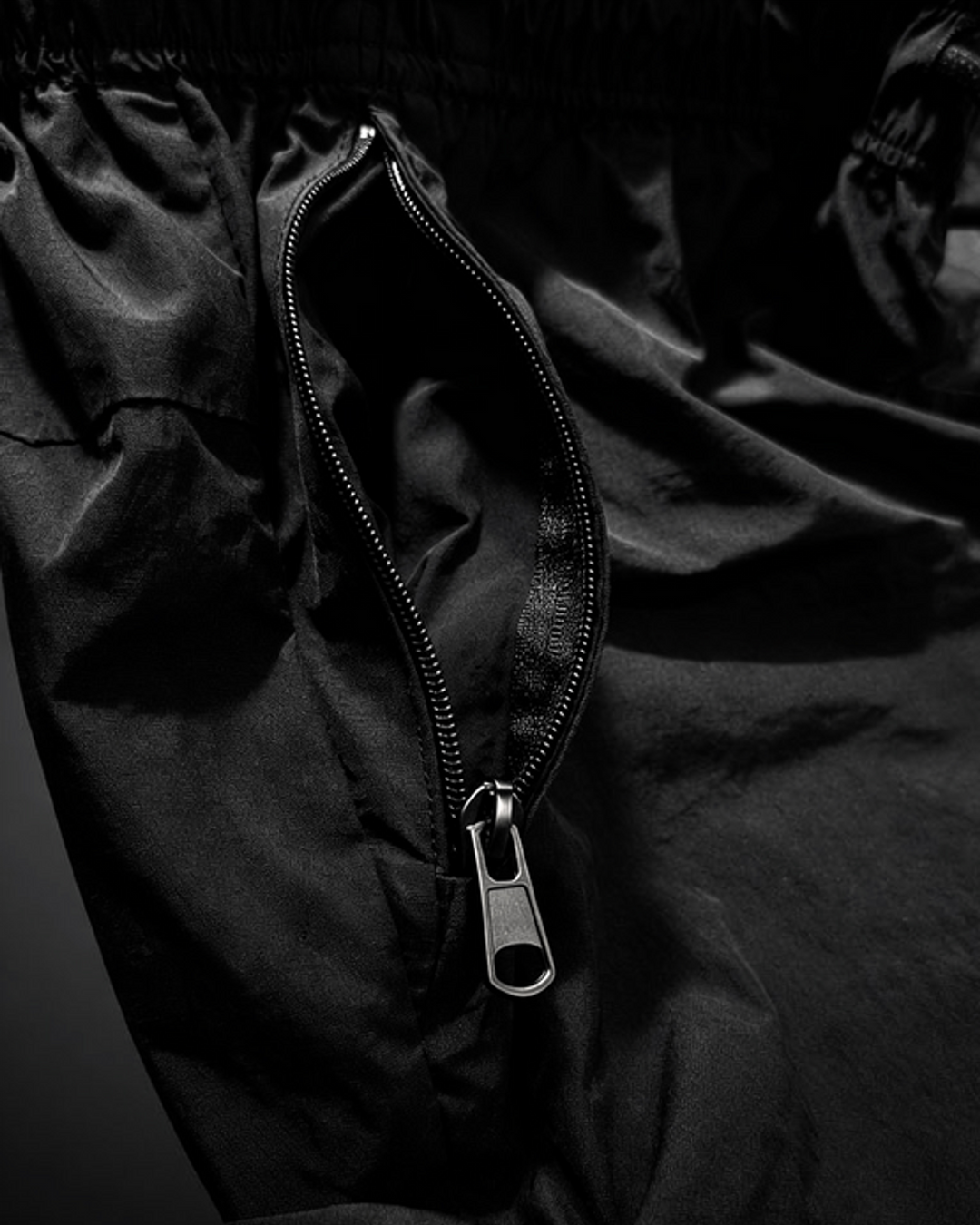 Close-up of the zip pocket on black DBXA Ironstrike Shorts.