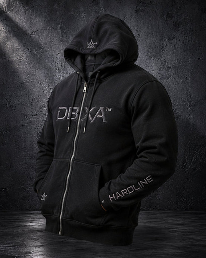 Black DBXA Ironveil zip hoodie front with metallic DBXA chest embroidery and HARDLINE sleeve branding.