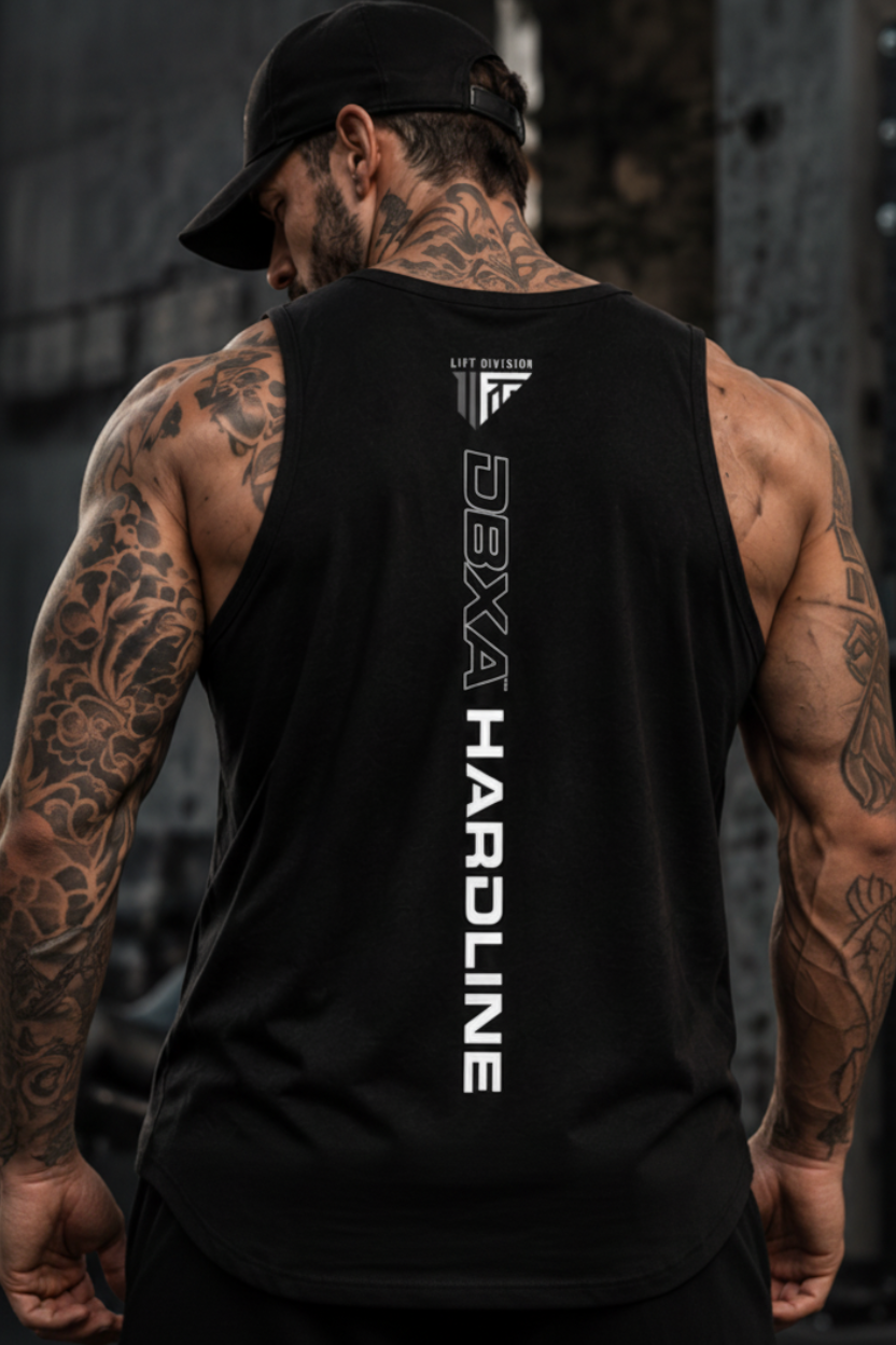 A muscular man wearing a black sleeveless tank top with white branding, shown from both front and back in a gym setting with a motorcycle and concrete wall visible.