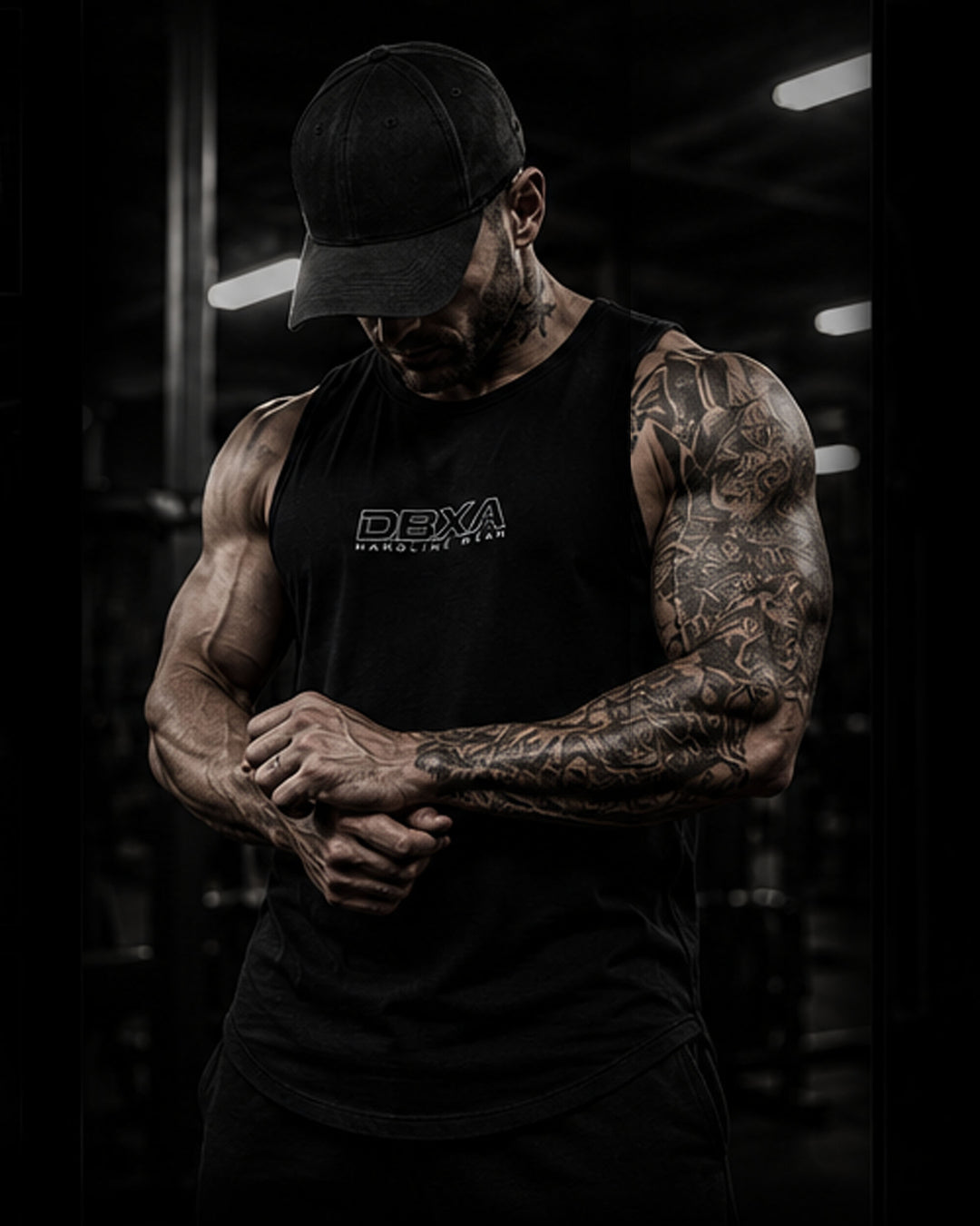 Muscular man wearing a black DBXA Hardline Tank from the front