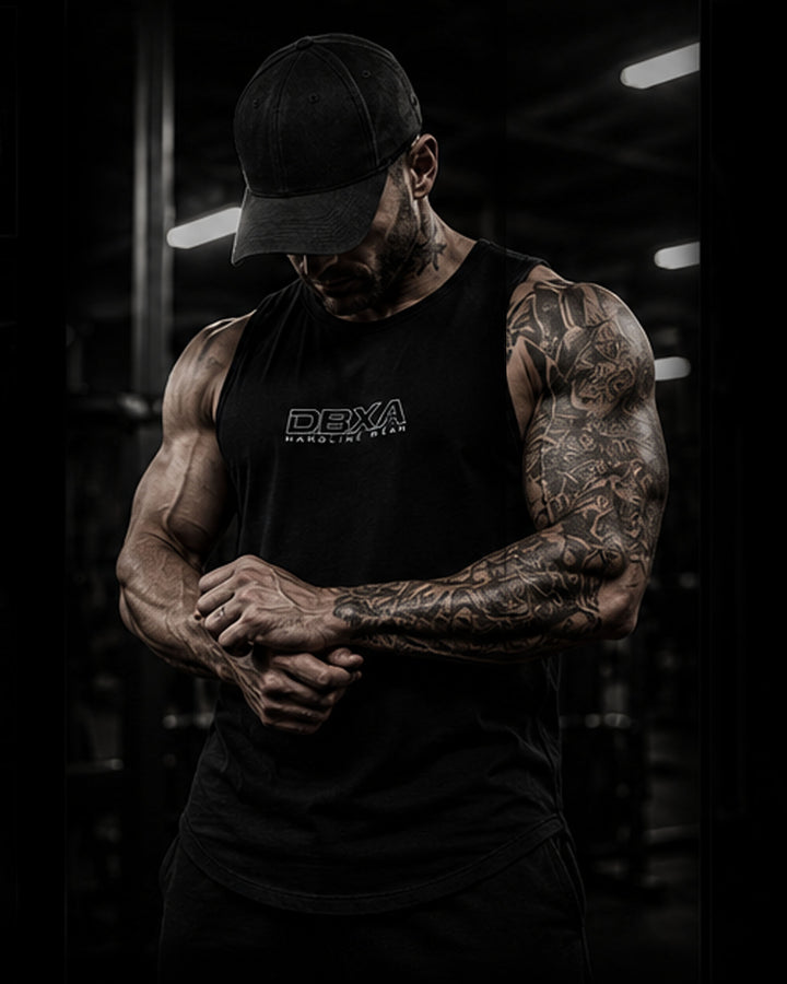 Muscular man wearing a black DBXA Hardline Tank from the front