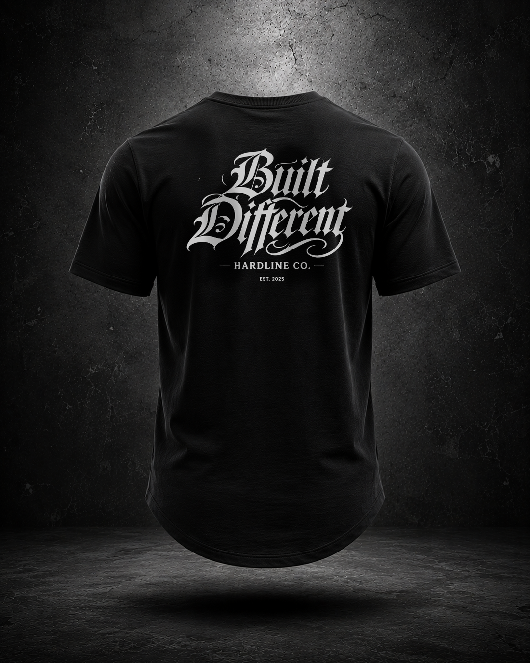 Black Hardline Co. Built Different tee rear view on textured grey background