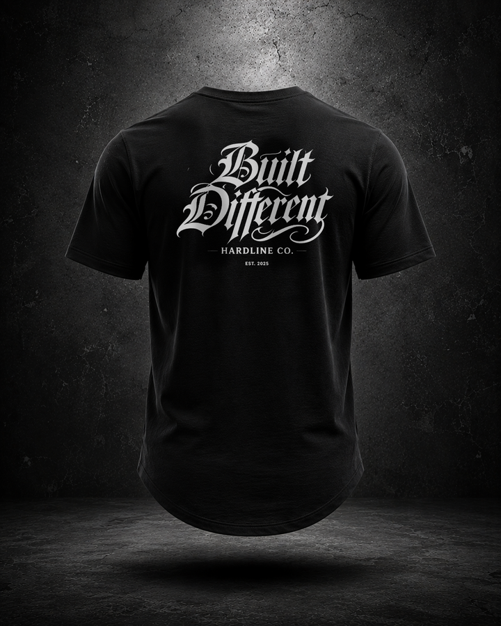 Black Hardline Co. Built Different tee rear view on textured grey background