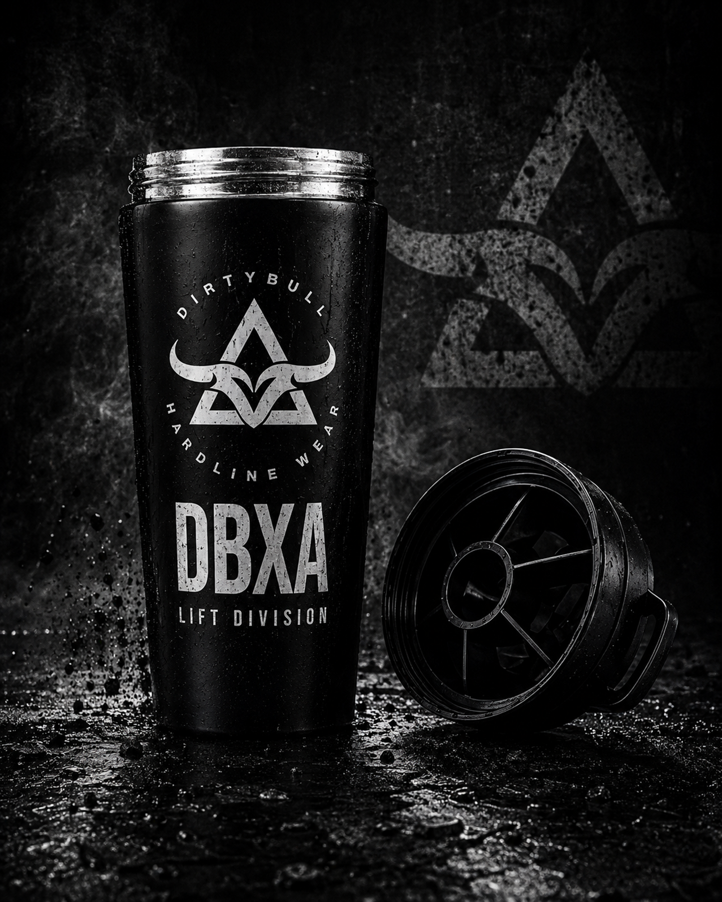Black tumbler with 'DBXA' branding on a dark background
