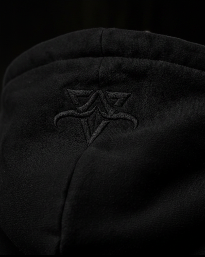 Close-up of the black DBXA Ironveil hood with embroidered DBXA branding.