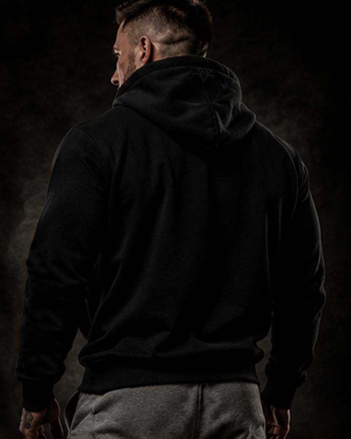 Rear view of the black DBXA Ironveil hoodie showing its plain back and embroidered hood detail.