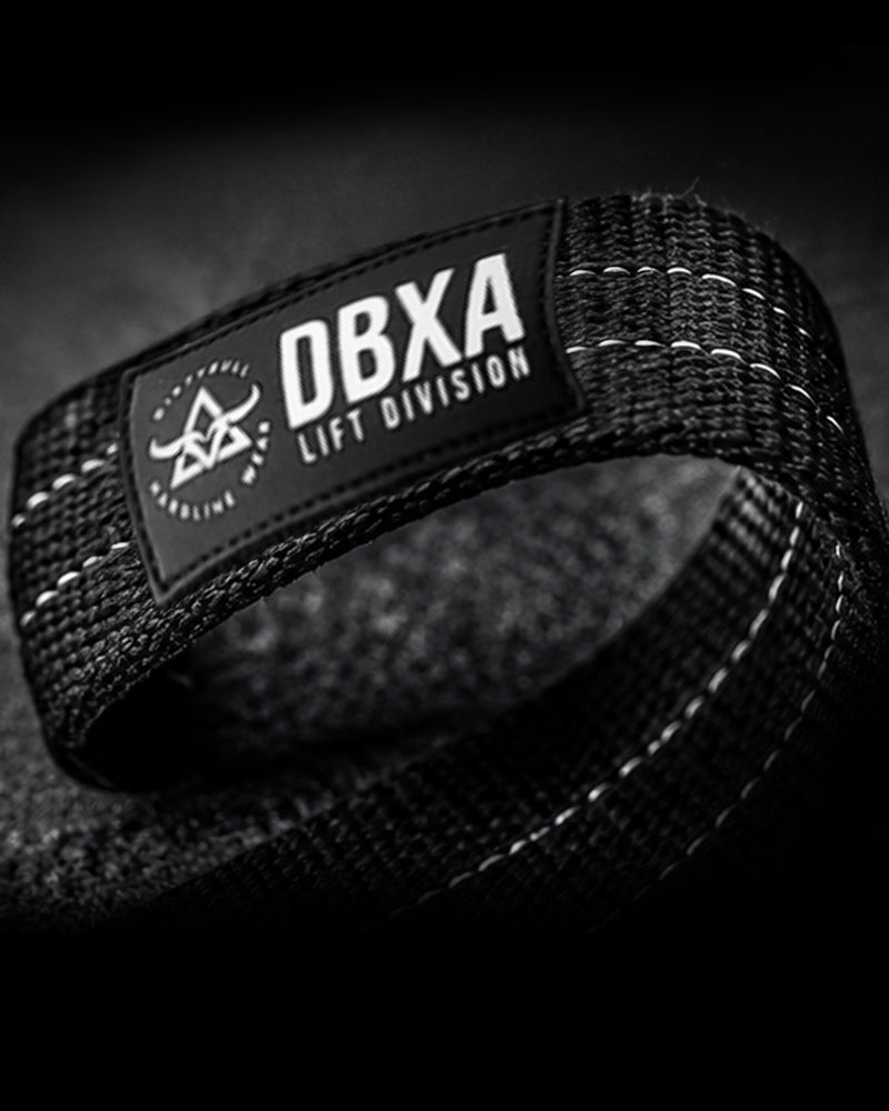 Black wrist wrap with DBXA Lift Division logo on a dark background