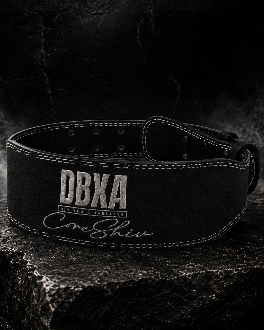 Black weightlifting belt with 'DBXA' branding on a dark background