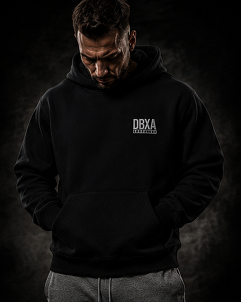 Man wearing a black hoodie with &