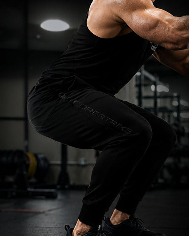 Person performing a squat exercise in a gym setting