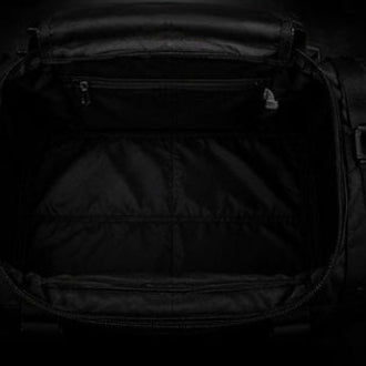 Black backpack with zippers on a black background