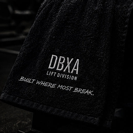 Black towel with 'DBXA Lift Division' text on a blurred background