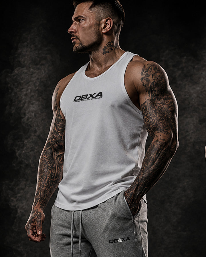 Tattooed man wearing a white DBXA Bullstrike Tank from the front